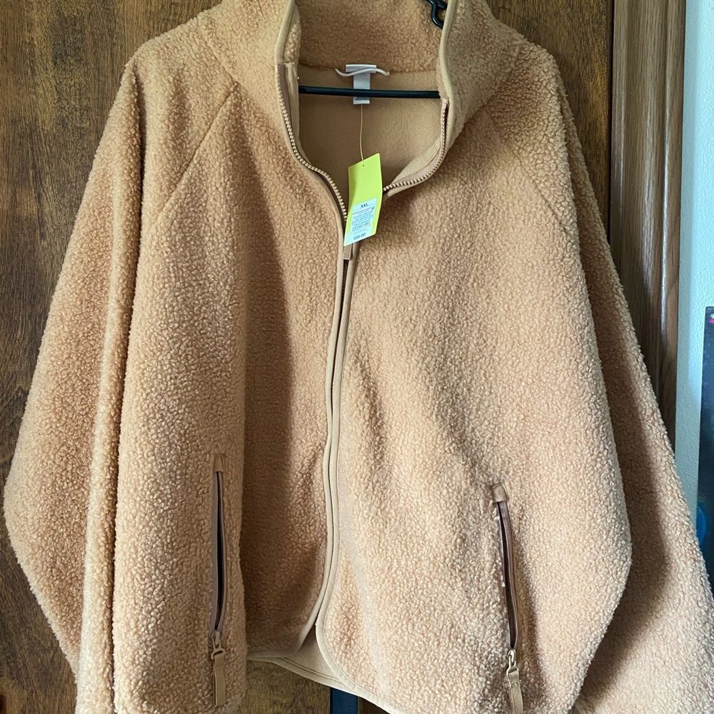 Brow/cream fuzzy zip up sweatshirt. Never worn